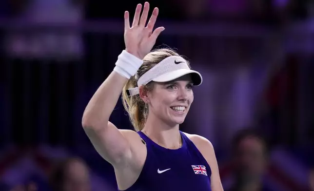 Katie Boulter, of Britain, celebrates after her victory over Canada's Leylah Fernandez in the Billie Jean King Cup Finals at Martin Carpena Sports Hall in Malaga, southern Spain, Sunday, Nov. 17, 2024. (AP Photo/Manu Fernandez)
