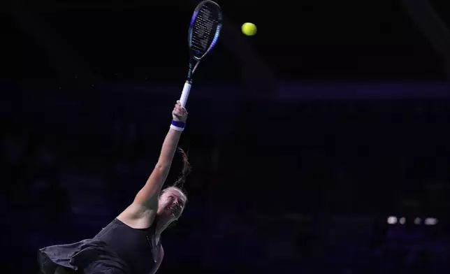 Slovakia's Viktoria Hruncakova serves to Australia's Kimberly Birrell during the Billie Jean King Cup Finals, at the Martin Carpena Sports Hall, in Malaga, southern Spain, on Sunday, Nov. 17, 2024. (AP Photo/Manu Fernandez)