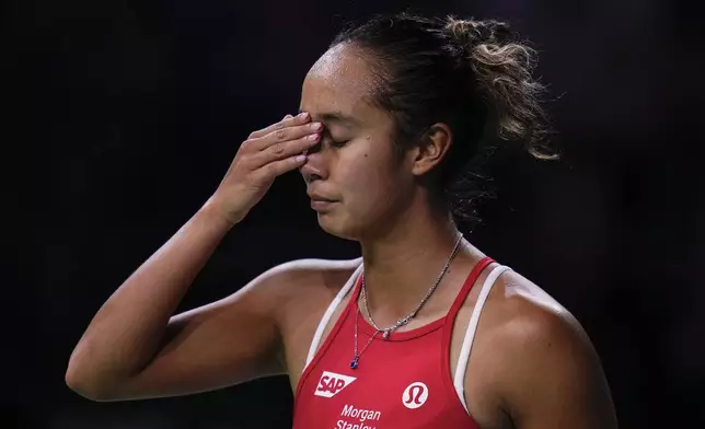 Canada's Leylah Fernandez reacts during haer match against Katie Boulter, of Britain, during the Billie Jean King Cup Finals at Martin Carpena Sports Hall in Malaga, southern Spain, Sunday, Nov. 17, 2024. (AP Photo/Manu Fernandez)