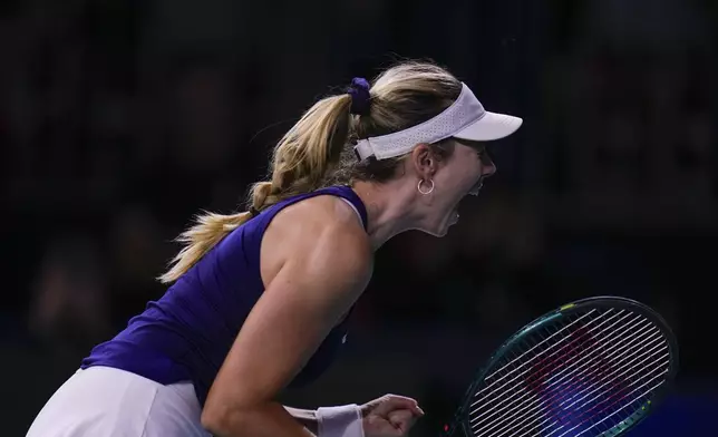 Katie Boulter, of Britain, celebrates after her victory against Canada's Leylah Fernandez in the Billie Jean King Cup Finals at Martin Carpena Sports Hall in Malaga, southern Spain, Sunday, Nov. 17, 2024. (AP Photo/Manu Fernandez)