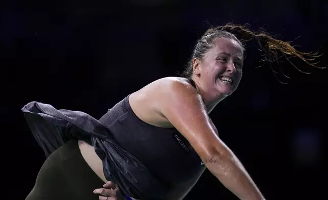 Slovakia's Viktoria Hruncakova returns the ball to Australia's Kimberly Birrell during the Billie Jean King Cup Finals, at the Martin Carpena Sports Hall, in Malaga, southern Spain, on Sunday, Nov. 17, 2024. (AP Photo/Manu Fernandez)