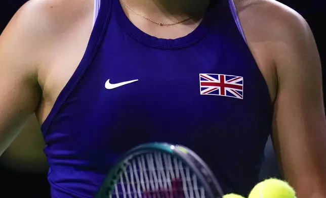 Emma Raducanu of Britain prepares to serve to Canada's Rebecca Marino during the Billie Jean King Cup Finals, at the Martin Carpena Sports Hall, in Malaga, southern Spain, on Sunday, Nov. 17, 2024. (AP Photo/Manu Fernandez)