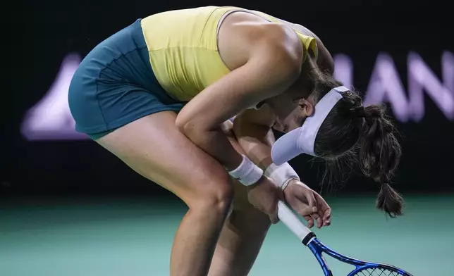 Australia's Kimberly Birrell reacts during the match against Slovakia's Viktoria Hruncakova in the Billie Jean King Cup Finals, at the Martin Carpena Sports Hall, in Malaga, southern Spain, on Sunday, Nov. 17, 2024. (AP Photo/Manu Fernandez)