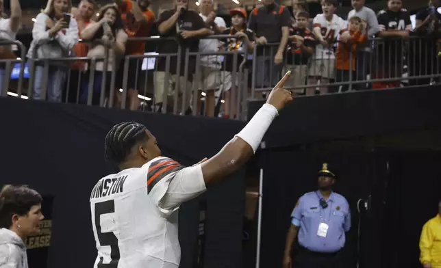 Cleveland Browns quarterback Jameis Winston (5) gestures to fans as he walks off the field in after an NFL football game against the New Orleans Saints in New Orleans, Sunday, Nov. 17, 2024. (AP Photo/Butch Dill)