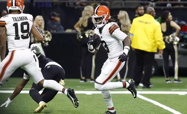 Cleveland Browns wide receiver Jerry Jeudy, right, carries a pass from quarterback Jameis Winston into the endzone for a touchdown in the first half of an NFL football game against the New Orleans Saints in New Orleans, Sunday, Nov. 17, 2024. (AP Photo/Butch Dill)