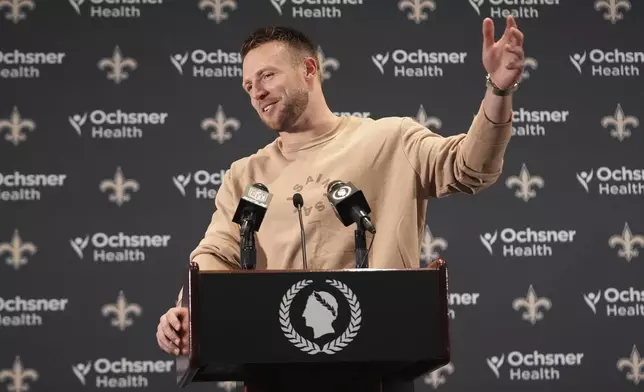 New Orleans Saints tight end Taysom Hill speaks during a news conference following an NFL football game against the Cleveland Browns in New Orleans, Sunday, Nov. 17, 2024. (AP Photo/Gerald Herbert)