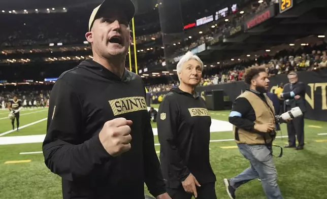 New Orleans Saints interim head coach Darren Rizzi gestures as he walks off the field after an NFL football game against the Cleveland Browns in New Orleans, Sunday, Nov. 17, 2024. (AP Photo/Gerald Herbert)