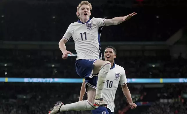 England's Anthony Gordon celebrates after scoring his side's second goal during the UEFA Nations League soccer match between England and the Republic of Ireland at Wembley stadium in London, Sunday, Nov. 17, 2024. (AP Photo/Kin Cheung)