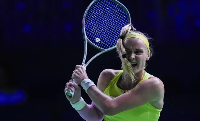 Slovakia's Rebecca Sramkova hits a return against Danielle Collins, of the United States, during a tennis match at the Billie Jean King Cup Finals at the Martin Carpena Sports Hall, Thursday, Nov. 14, 2024, in Malaga, southern Spain. (AP Photo/Manu Fernandez)