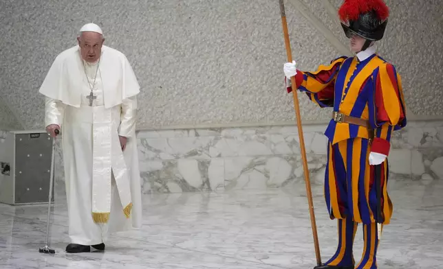 Pope Francis arrives for an audience with fishermen and members of the CEI, Italians Bishops Conference, in the Pope Paul VI hall at the Vatican, Saturday, Nov. 23, 2024. (AP Photo/Andrew Medichini)