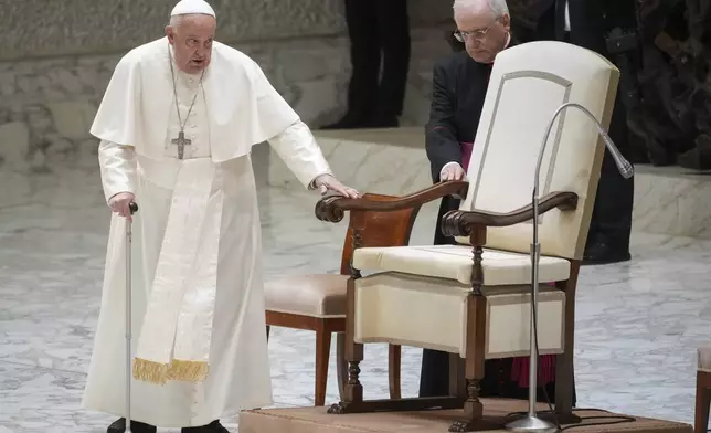 Pope Francis arrives for an audience with fishermen and members of the CEI, Italians Bishops Conference, in the Pope Paul VI hall at the Vatican, Saturday, Nov. 23, 2024. (AP Photo/Andrew Medichini)