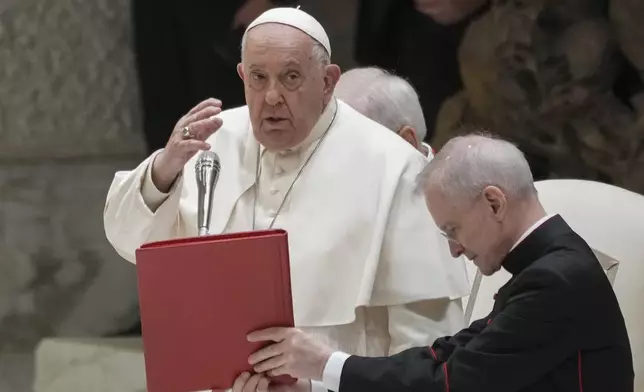 Pope Francis delivers his blessing during an audience with fishermen and members of the CEI, Italians Bishops Conference, in the Pope Paul VI hall at the Vatican, Saturday, Nov. 23, 2024. (AP Photo/Andrew Medichini)