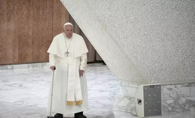 Pope Francis arrives for an audience with fishermen and members of the CEI, Italians Bishops Conference, in the Pope Paul VI hall at the Vatican, Saturday, Nov. 23, 2024. (AP Photo/Andrew Medichini)