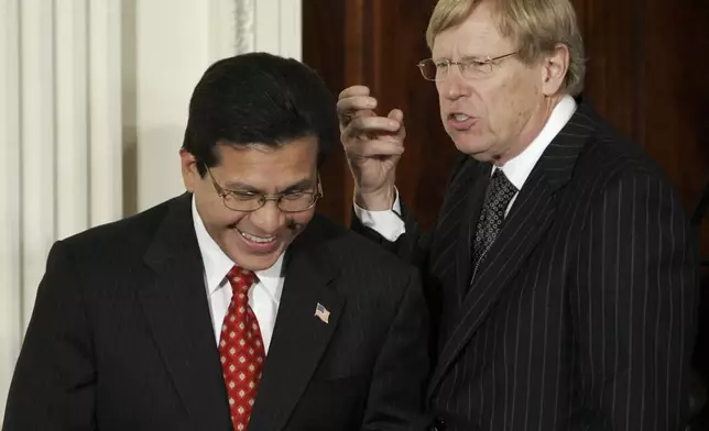 FILE - Attorney General Alberto Gonzales, left, talks with former Solicitor General Ted Olson, before President Bush delivers a speech on terrorism in the East Room of the White House in Washington, Sept. 6, 2006. (AP Photo/Gerald Herbert, File)