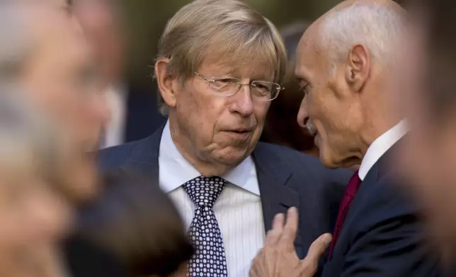 FILE - Former United States Solicitor General Ted Olson, center, speaks with former Homeland Security Secretary Michael Chertoff, right, before an installation ceremony for FBI Director Chris Wray at the FBI Building, Sept. 28, 2017, in Washington. (AP Photo/Andrew Harnik, File)