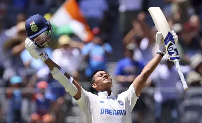 India's Yashasvi Jaiswal celebrates his century on the third day of the first cricket test between Australia and India in Perth, Australia, Sunday, Nov. 24, 2024. (AP Photo/Trevor Collens)