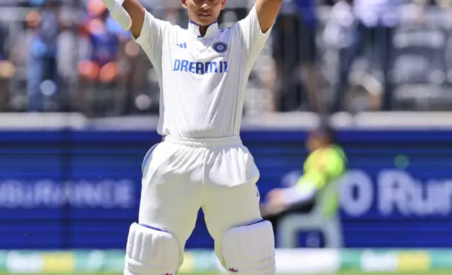 India's Yashasvi Jaiswal celebrates his century on the third day of the first cricket test between Australia and India in Perth, Australia, Sunday, Nov. 24, 2024. (AP Photo/Trevor Collens)