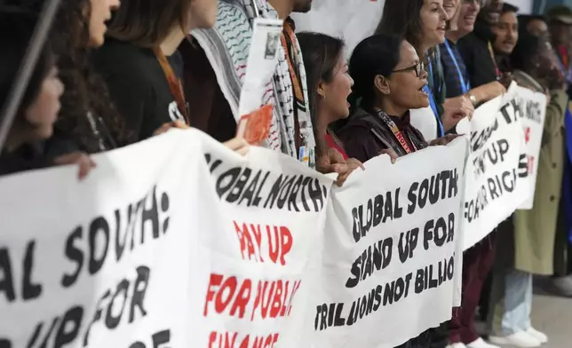 Activists participate in a demonstration for climate finance at the COP29 U.N. Climate Summit, Wednesday, Nov. 20, 2024, in Baku, Azerbaijan. (AP Photo/Peter Dejong)