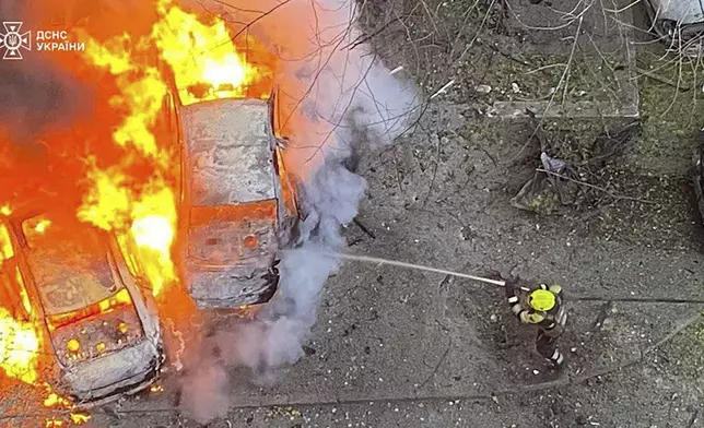 In this photo provided by the Ukrainian Emergency Service, emergency services personnel work to extinguish a fire following a Russian rocket attack in Poltava region Ukraine, Sunday, Nov. 17, 2024. (Ukrainian Emergency Service via AP)