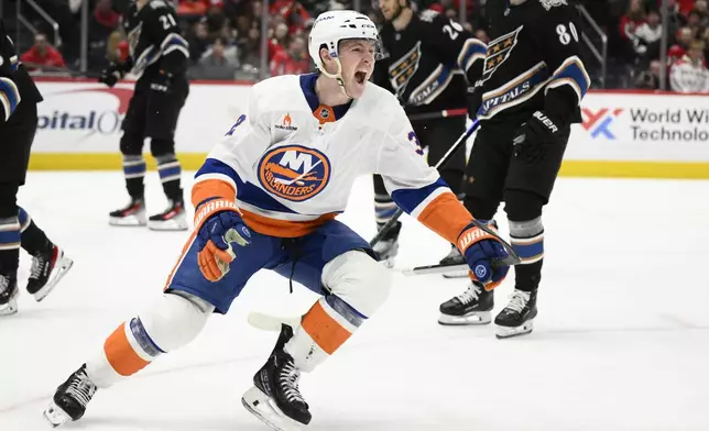 New York Islanders center Kyle MacLean (32) celebrates after his goal during the second period of an NHL hockey game against the Washington Capitals, Friday, Nov. 29, 2024, in Washington. (AP Photo/Nick Wass)