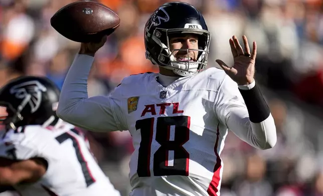 Atlanta Falcons quarterback Kirk Cousins (18) passes the ball against the Denver Broncos during the first half of an NFL football game, Sunday, Nov. 17, 2024, in Denver. (AP Photo/Jack Dempsey)