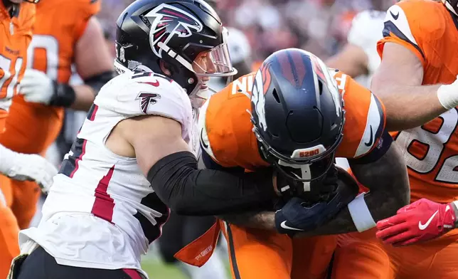 Denver Broncos wide receiver Troy Franklin (16) runs into the end zone for a touchdown against the Atlanta Falcons during the second half of an NFL football game, Sunday, Nov. 17, 2024, in Denver. (AP Photo/Jack Dempsey)