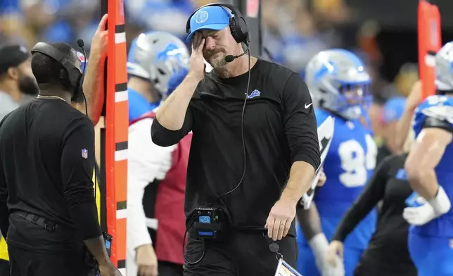 Detroit Lions head coach Dan Campbell reacts against the Chicago Bears during the second half of an NFL football game in Detroit, Thursday, Nov. 28, 2024. (AP Photo/Carlos Osorio)