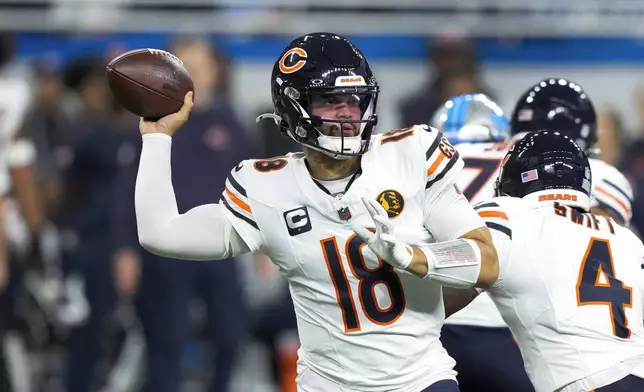 Chicago Bears quarterback Caleb Williams (18) throws against the Detroit Lions during the first half of an NFL football game, Sunday, Nov. 17, 2024, in Detroit. (AP Photo/Carlos Osorio)