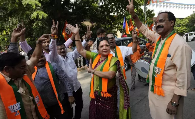 Bhartiya Janata Party workers celebrates after leading in Maharashtra state assembly elections in Mumbai, India, Saturday, Nov 23, 2024.(AP Photo/Rajanish Kakade)