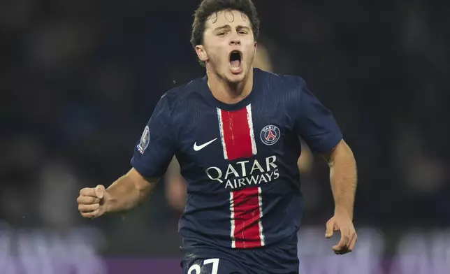 PSG's Joao Neves celebrates after scoring during the French League One soccer match between Paris Saint-Germain and Toulouse at the Parc des Princes stadium in Paris, France, Sunday, Nov. 22, 2024. (AP Photo/Michel Euler)