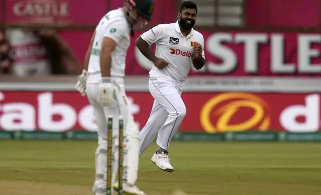 Sri Lanka's Lahiru Kumara, right, celebrates after bowling South Africa's David Bedingham during day one of the first Test cricket match between South Africa and Sri Lanka, at Kingsmead stadium in Durban, South Africa, Wednesday, Nov. 27, 2024. (AP Photo/Themba Hadebe)