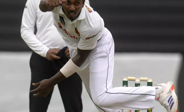 Sri Lanka's bowler Vishwa Fernando follows through his delivery during day one of the first Test cricket match between South Africa and Sri Lanka, at Kingsmead stadium in Durban, South Africa, Wednesday, Nov. 27, 2024. (AP Photo/Themba Hadebe)