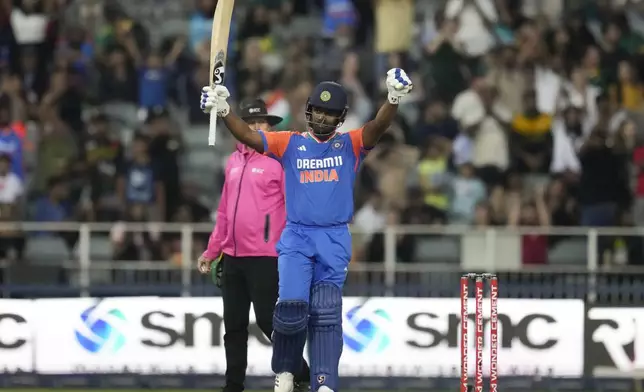 India's Sanju Samson celebrates after scoring a century during the fourth T20 cricket match between South Africa and India at the Wanderers Stadium in Johannesburg, South Africa, Friday, Nov. 15, 2024. (AP Photo/Themba Hadebe)