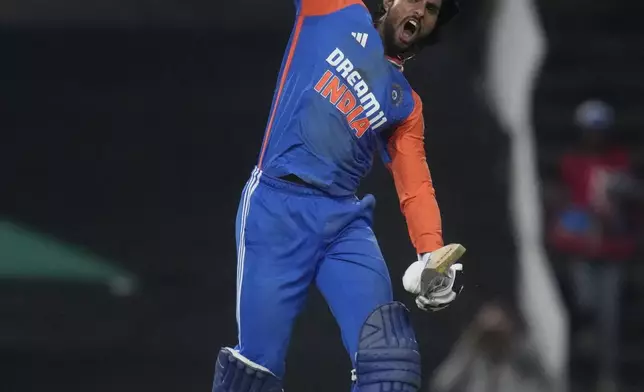 India's Tilak Varma celebrates after scoring a century during the fourth T20 cricket match between South Africa and India at the Wanderers Stadium in Johannesburg, South Africa, Friday, Nov. 15, 2024. (AP Photo/Themba Hadebe)