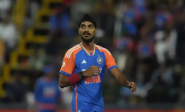 India's Arshdeep Singh reacts after bowling a delivery during the fourth T20 cricket match between South Africa and India at the Wanderers Stadium in Johannesburg, South Africa, Friday, Nov. 15, 2024. (AP Photo/Themba Hadebe)