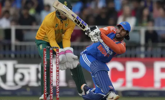 India's Tilak Varma watches the ball after playing a shot during the fourth T20 cricket match between South Africa and India at the Wanderers Stadium in Johannesburg, South Africa, Friday, Nov. 15, 2024. (AP Photo/Themba Hadebe)