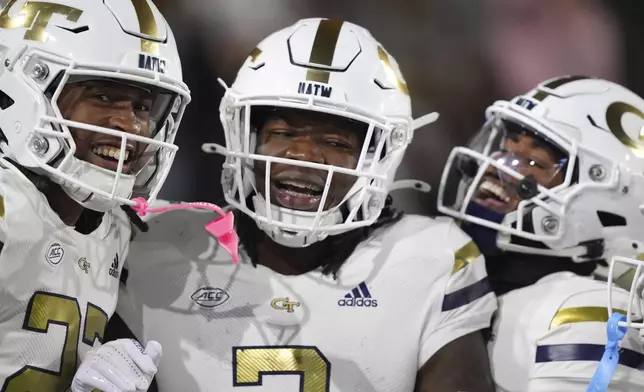 Georgia Tech linebacker E.J. Lightsey (2) celebrates a touchdown after an interception during the first half of an NCAA college football game against North Carolina State, Thursday, Nov. 21, 2024, in Atlanta. (AP Photo/Brynn Anderson)