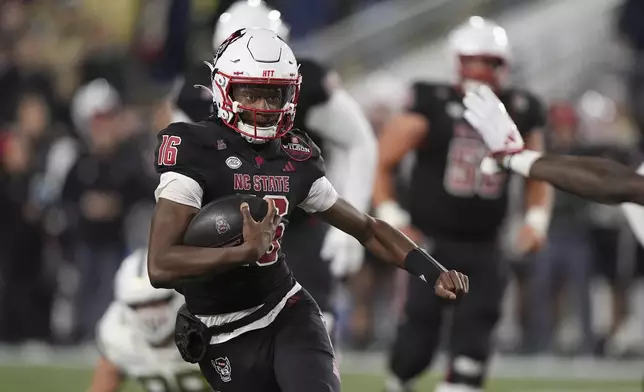 North Carolina State quarterback CJ Bailey (16) runs the ball during the first half of an NCAA college football game against Georgia Tech, Thursday, Nov. 21, 2024, in Atlanta. (AP Photo/Brynn Anderson)