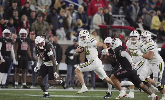 Georgia Tech quarterback Haynes King (10) runs the ball during the first half of an NCAA college football game against North Carolina State, Thursday, Nov. 21, 2024, in Atlanta. (AP Photo/Brynn Anderson)