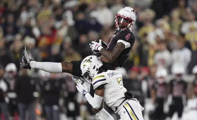 Georgia Tech defensive back Clayton Powell-Lee (5) tackles Georgia Tech wide receiver Abdul Janneh Jr. (4) during the first half of an NCAA college football game, Thursday, Nov. 21, 2024, in Atlanta. (AP Photo/Brynn Anderson)