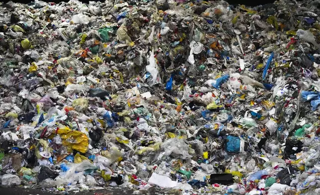 Plastic garbage storage in a hall of the Interzero plastic sorting facility in Berlin, Germany, Wednesday, Nov. 27, 2024. (AP Photo/Markus Schreiber)