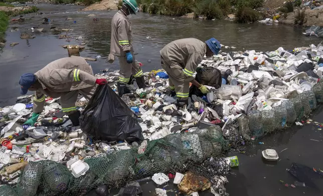 Alexandra Water Warriors volunteers cleanup the Juksei river in the heart of Alexandra township from Plastic pollution in Johannesburg, South Africa, Wednesday, Nov. 27, 2024. (AP Photo/Jerome Delay)