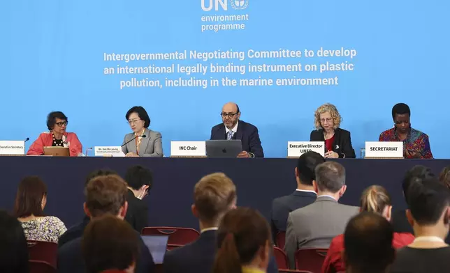 Chair of the International Negotiating Committee, Luis Vayas Valdivieso, center, speaks next to Inger Andersen, Executive Director of UNEP, second from right, during the press conference for the fifth session of the Intergovernmental Negotiating Committee on Plastic Pollution in Busan, South Korea, Monday, Nov. 25, 2024. (Son Hyung-joo/Yonhap via AP)