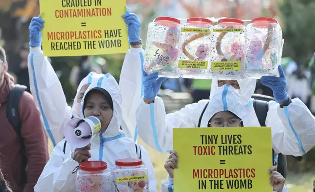 Children attend a rally calling for a strong global plastics treaty ahead of the fifth session of the Intergovernmental Negotiating Committee on Plastic Pollution which sets to be held from Nov. 25 to Dec. 1 in Busan, South Korea, Saturday, Nov. 23, 2024. (Son Hyung-joo/Yonhap via AP)