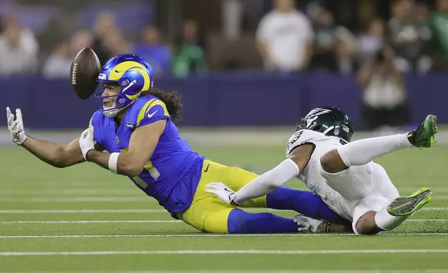 Los Angeles Rams wide receiver Puka Nacua, left, cannot catch a pass against Philadelphia Eagles cornerback Darius Slay Jr. during the first half of an NFL football game in Inglewood, Calif., Sunday, Nov. 24, 2024. (AP Photo/Ryan Sun)