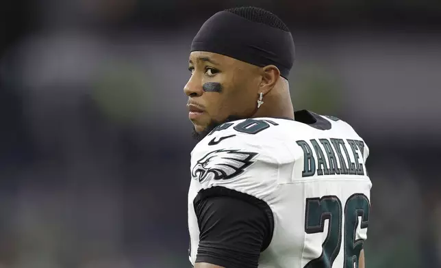 Philadelphia Eagles running back Saquon Barkley warms up before an NFL football game against the Los Angeles Rams in Inglewood, Calif., Sunday, Nov. 24, 2024. (AP Photo/Ryan Sun)