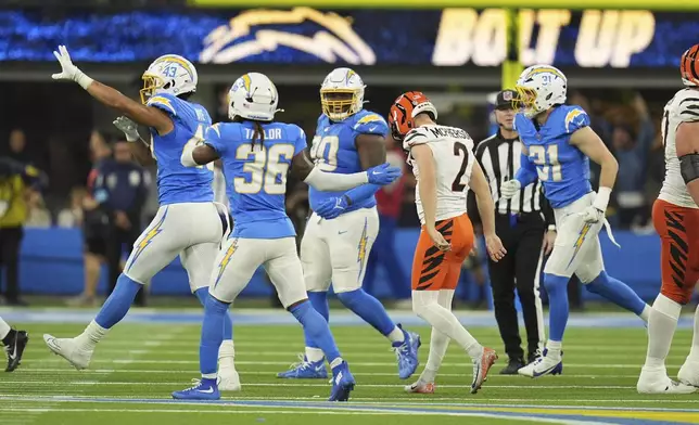 Cincinnati Bengals place kicker Evan McPherson (2) lowers his head after missing on a field goal attempt during the second half of an NFL football game against the Los Angeles Chargers, Sunday, Nov. 17, 2024, in Inglewood, Calif. (AP Photo/Gregory Bull)