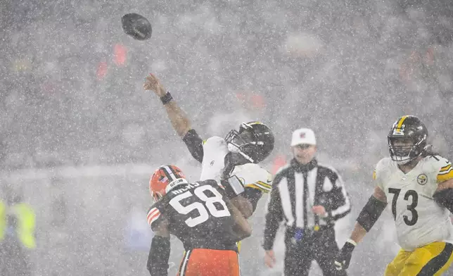 Pittsburgh Steelers quarterback Russell Wilson throws a Hail Mary pass on the final play of the game in the second half of an NFL football game against the Cleveland Browns, Thursday, Nov. 21, 2024, in Cleveland. The Browns won 24-19. (AP Photo/David Richard)