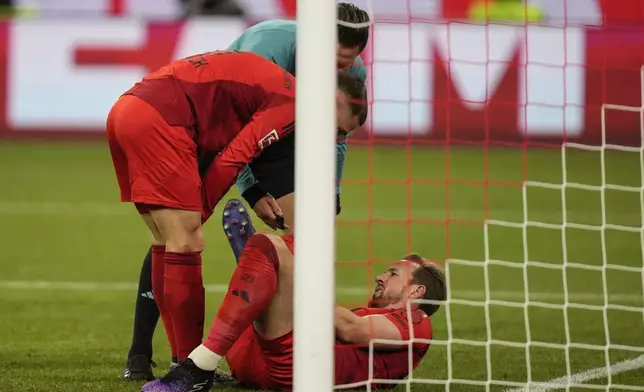 Bayern's Harry Kane on the pitch during the Bundesliga soccer match between Bayern Munich and Augsburg at the Allianz Arena in Munich, Germany, Friday, Nov. 22, 2024. (AP Photo/Matthias Schrader)