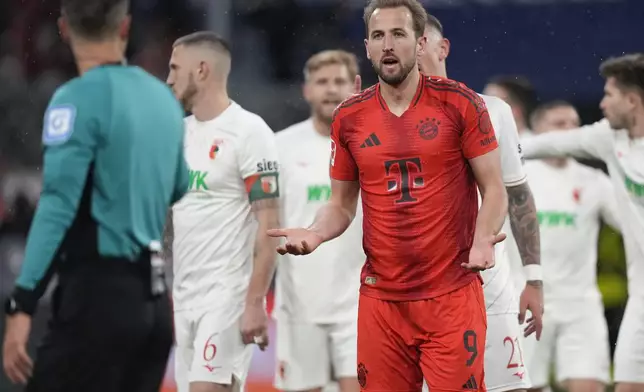 Bayern's Harry Kane, reacts to referee asking for a penalty during the Bundesliga soccer match between Bayern Munich and Augsburg at the Allianz Arena in Munich, Germany, Friday, Nov. 22, 2024. (AP Photo/Matthias Schrader)